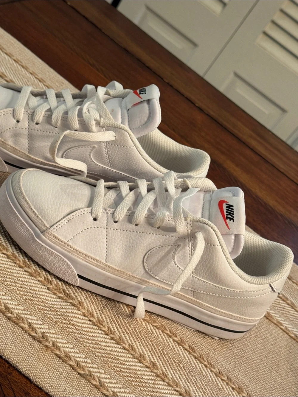 Nike White Low-Top Sneakers with Red Tongue Logo